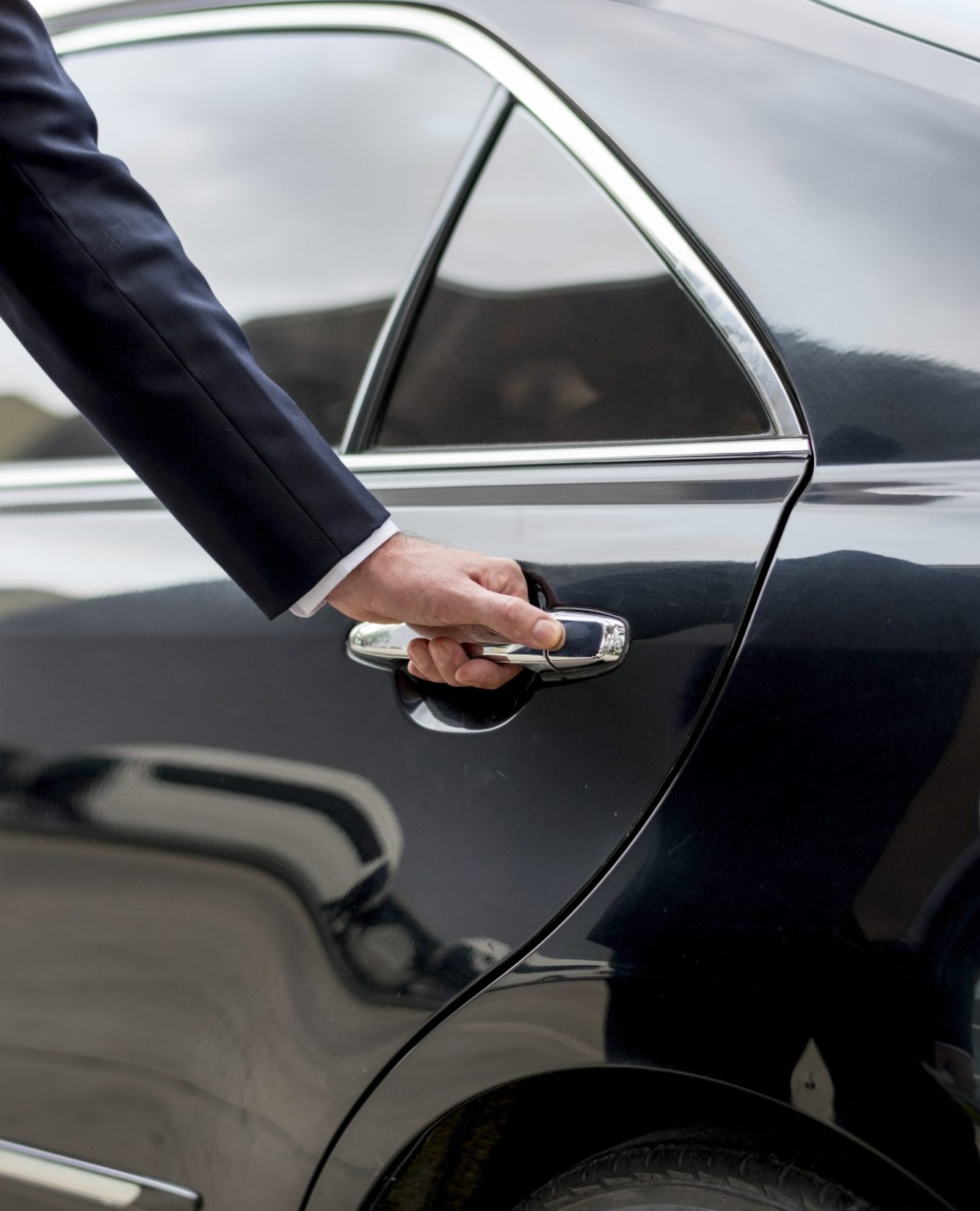 Businessman going inside his car